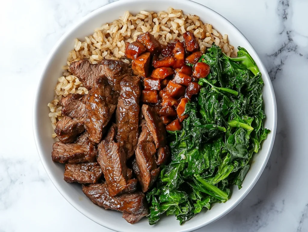 Beef bowl with tender beef slices, sautéed kale, brown rice, and glazed sweet potatoes, highlighting a popular beef dish."